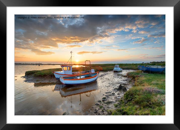 Stunning sunset over old fishing boats Framed Mounted Print by Helen Hotson