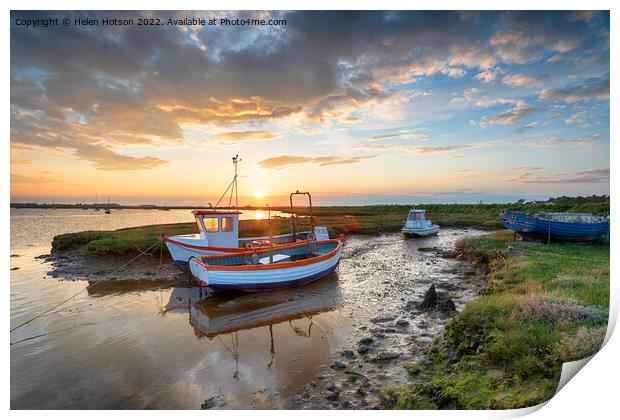Stunning sunset over old fishing boats Print by Helen Hotson