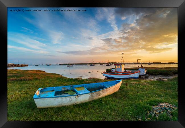 Beautiful sunset over old fishing boats in Suffolk Framed Print by Helen Hotson