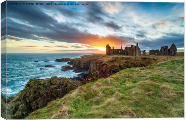Dramatic sunset over the ruins Slains Castle Canvas Print by Helen Hotson
