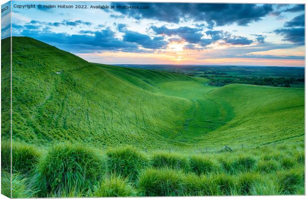 Dramatic sunset over The Manger at Uffington Canvas Print by Helen Hotson
