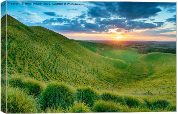 Dramatic sunset over The Manger in Uffington Canvas Print by Helen Hotson
