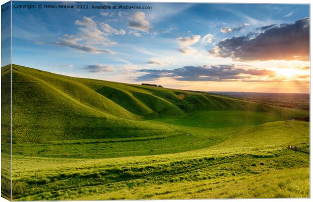Dramatic sunset over The Manger at Uffington in Oxforshire, Canvas Print by Helen Hotson