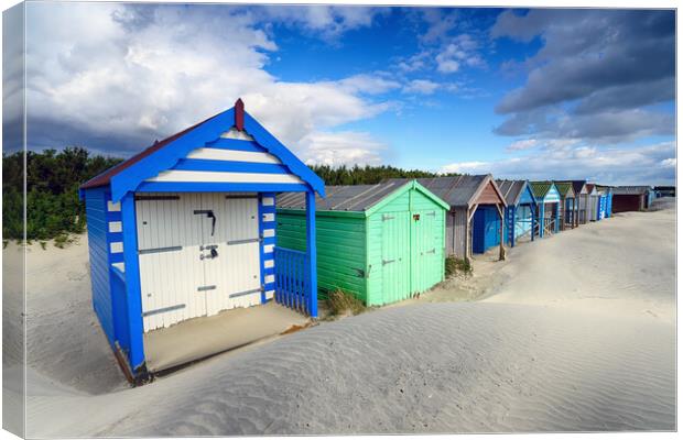 Colourful Beach Huts Canvas Print by Helen Hotson