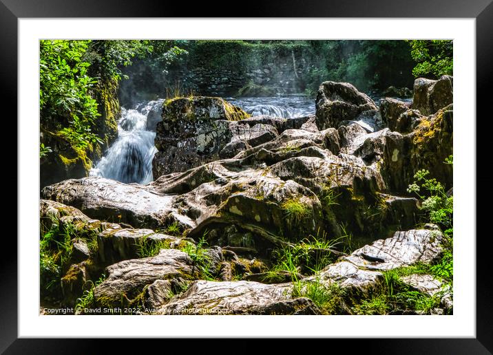 A large waterfall over a rocky cliff Framed Mounted Print by David Smith