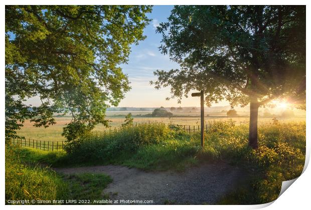 Footpath sign in rural sunrise landscape Norfolk Print by Simon Bratt LRPS