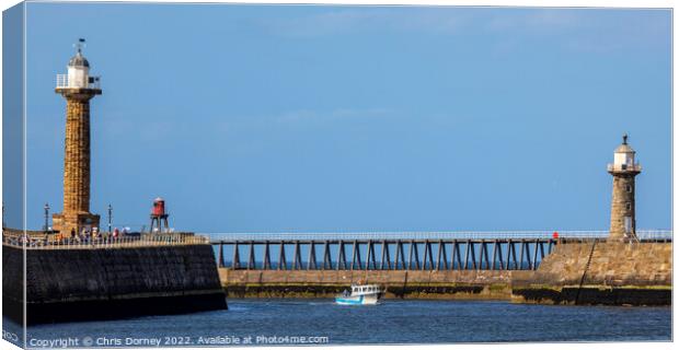 Lighthouses at Whitby Harbour in Whitby, North Yorkshire Canvas Print by Chris Dorney