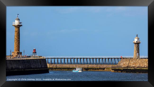 Lighthouses at Whitby Harbour in Whitby, North Yorkshire Framed Print by Chris Dorney