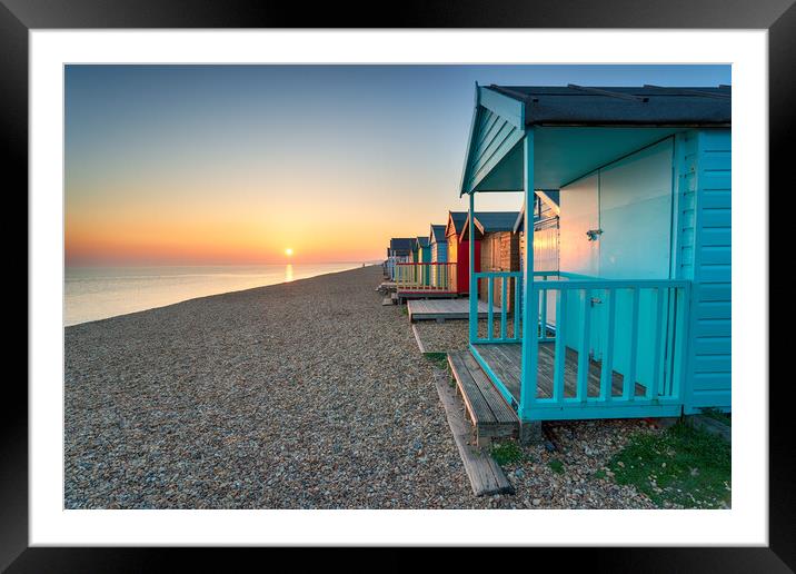 Stunning sunset over seaside beach huts  Framed Mounted Print by Helen Hotson