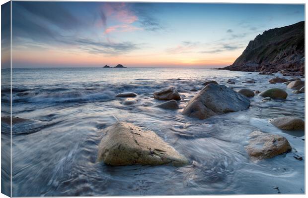 Sunset over Porth Nanven in Cornwall Canvas Print by Helen Hotson