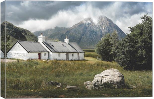 Black Rock Cottage and The Buachaille Canvas Print by Anthony McGeever