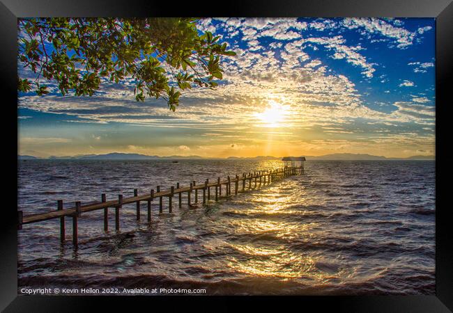Sunrise over a pier in Phang Nga Bay Framed Print by Kevin Hellon