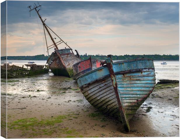 A Boat Graveyard on the River Orwell in Suffolk Canvas Print by Helen Hotson