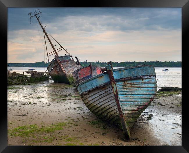 A Boat Graveyard on the River Orwell in Suffolk Framed Print by Helen Hotson