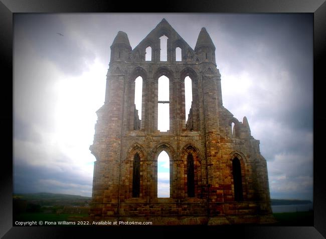 Whitby Abbey on a cloudy day Framed Print by Fiona Williams