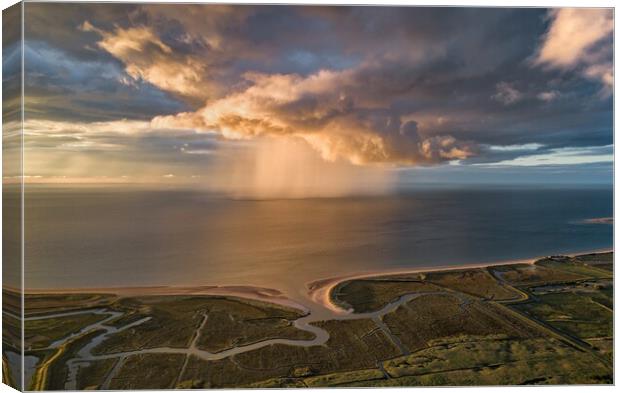 A sunset rain shower out at sea  Canvas Print by Gary Pearson