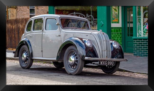 A vintage Morris Eight parked on a street Framed Print by George Robertson