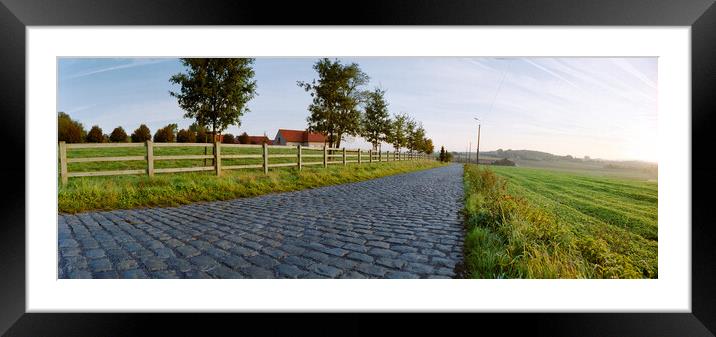 paving sett road  in autumnal sunlight Framed Mounted Print by youri Mahieu