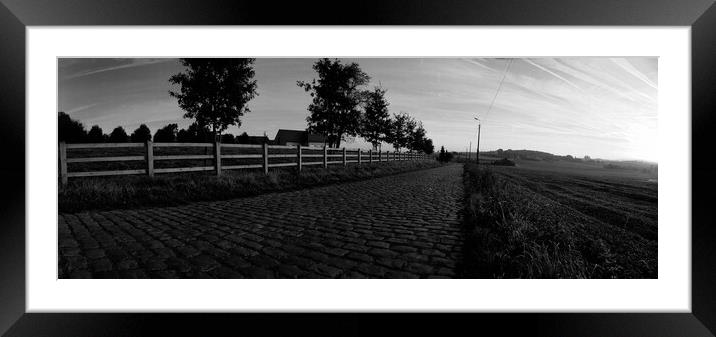 paving sett road in autumnal sunlight in black and white Framed Mounted Print by youri Mahieu