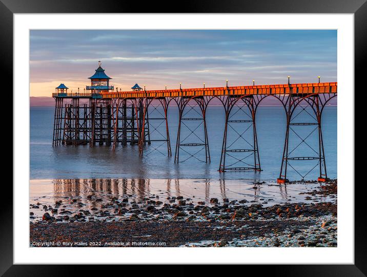 Clevedon Pier at sunset with a low tide Framed Mounted Print by Rory Hailes
