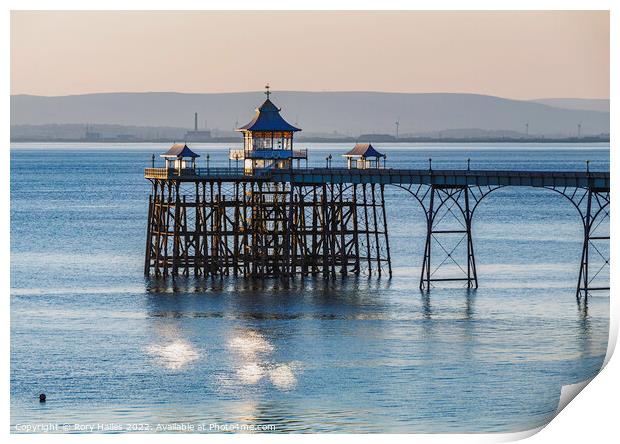 Clevedon Pier with sunlight reflecting onto the sea Print by Rory Hailes