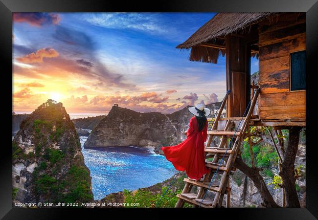 Young girl on steps of house on tree at sunrise in Nusa Penida  Framed Print by Stan Lihai