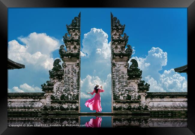 Young woman standing in temple gates at Lempuyang Luhur temple  Framed Print by Stan Lihai