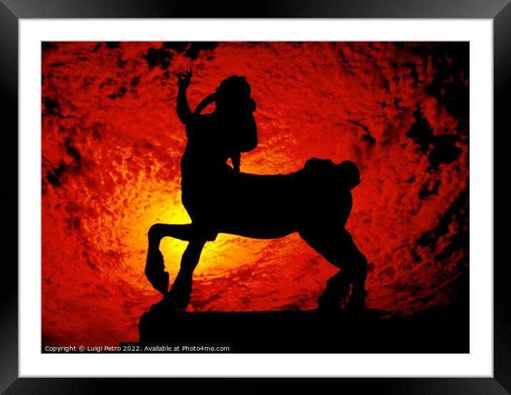 Sculpture of a Centaur against a red hot sky. Framed Mounted Print by Luigi Petro