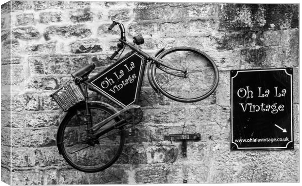 French Elegance: Vintage Bicycle Against Brick Fac Canvas Print by Holly Burgess