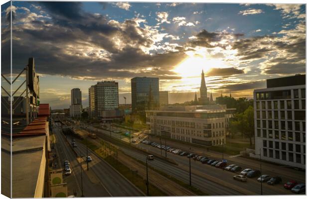 Wide angle aerial view of Lodz cityscape with mix of modern and medieval architecture next to highway against dramatic sunset Canvas Print by Arpan Bhatia