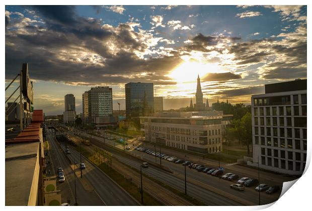 Wide angle aerial view of Lodz cityscape with mix of modern and medieval architecture next to highway against dramatic sunset Print by Arpan Bhatia