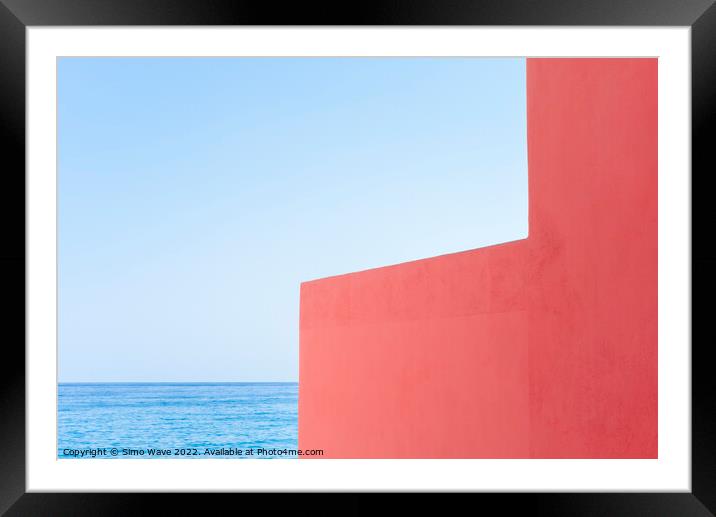 Pink wall against blue sea and sky Framed Mounted Print by Simo Wave