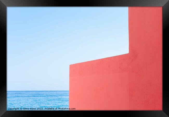 Pink wall against blue sea and sky Framed Print by Simo Wave
