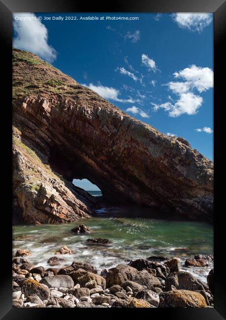 A natural sea arch near Portknockie on the north-e Framed Print by Joe Dailly