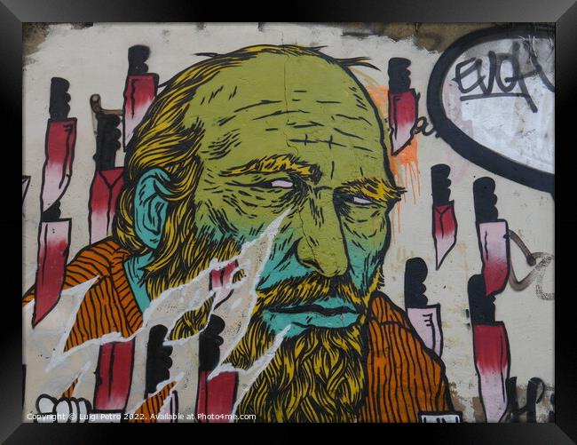 Graffiti showing an old man, London, UK. Framed Print by Luigi Petro