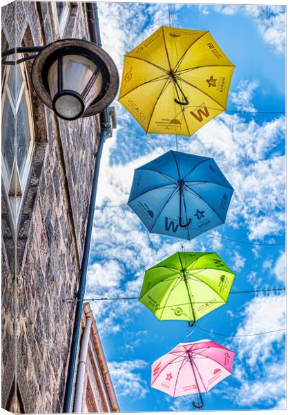 Hanging Umbrellas Canvas Print by Valerie Paterson