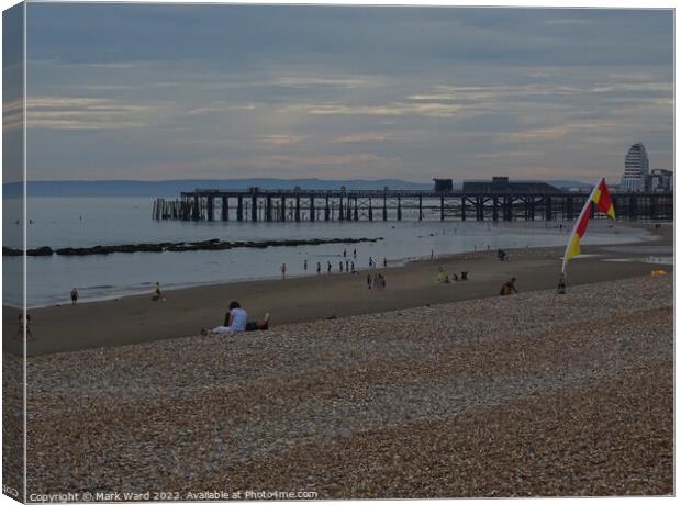 Early Summer evening on Hastings beach Canvas Print by Mark Ward