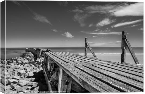 Old breakwater at Lossiemouth beach Canvas Print by Joe Dailly