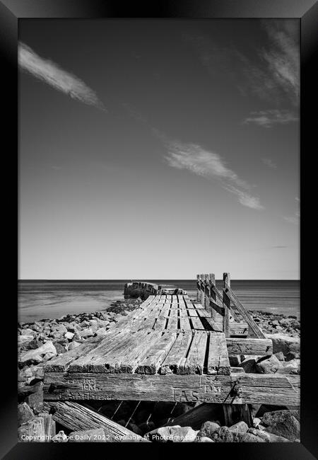 Old breakwater at Lossiemouth beach in Mono Framed Print by Joe Dailly