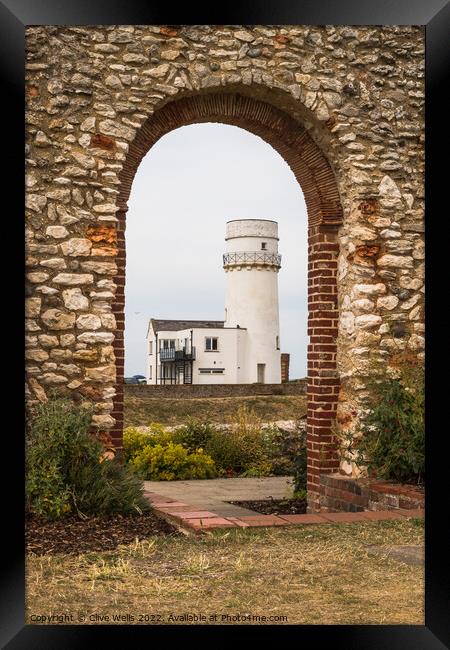 Framed lighthouse. Framed Print by Clive Wells