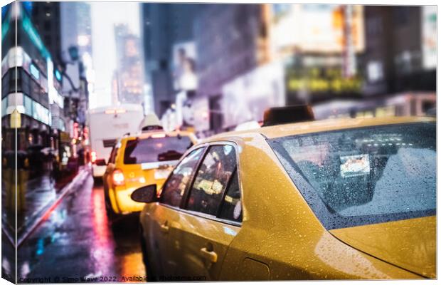 Taxi cab in the rain in NYC Canvas Print by Simo Wave