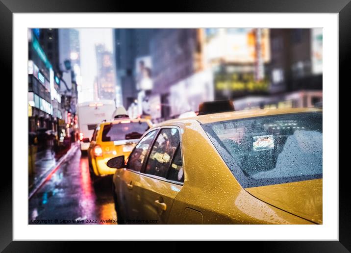 Taxi cab in the rain in NYC Framed Mounted Print by Simo Wave