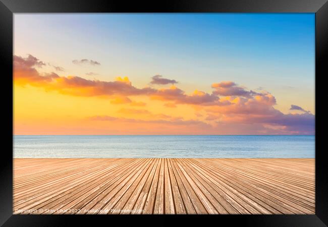 Sunset on the beach Framed Print by Stan Lihai