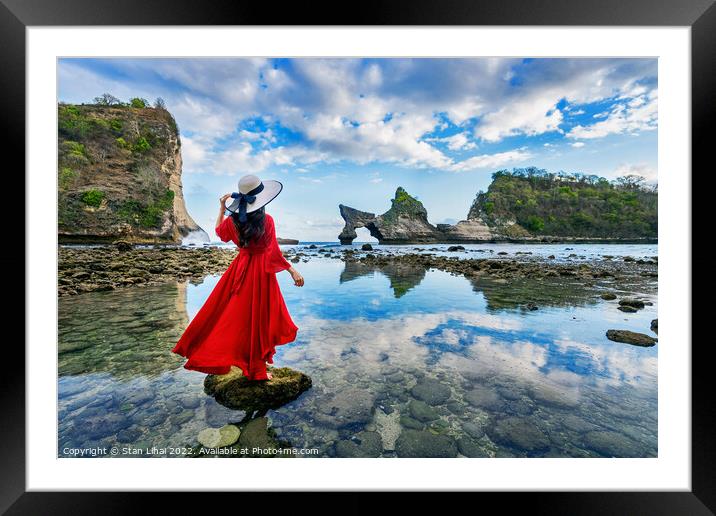 Woman standing on the rock at Atuh beach, Nusa penida island Framed Mounted Print by Stan Lihai