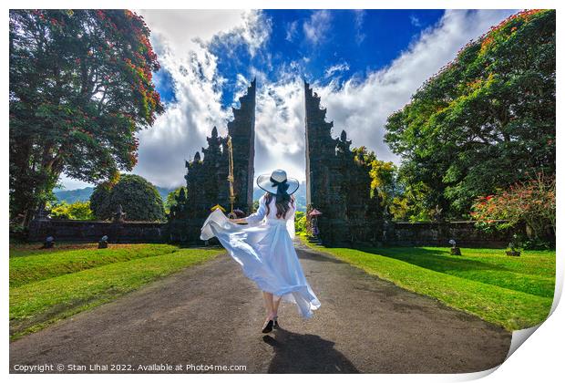 Woman walking at big entrance gate, Bali in Indonesia Print by Stan Lihai