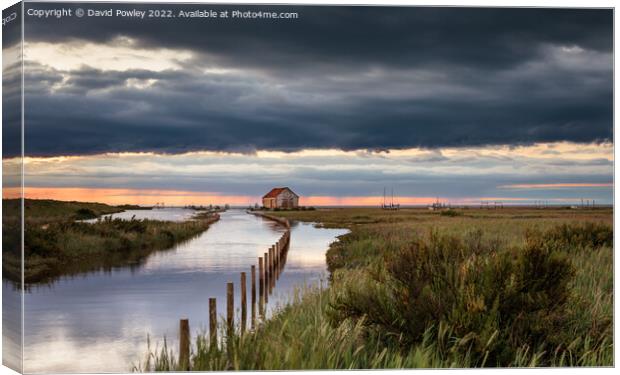 Sunset Reflections in Flooded Thornham Harbour Canvas Print by David Powley
