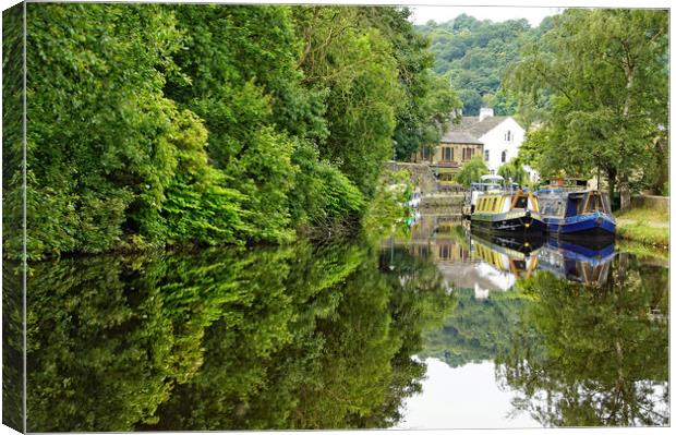 Canal side reflections at Todmorden. Canvas Print by David Birchall