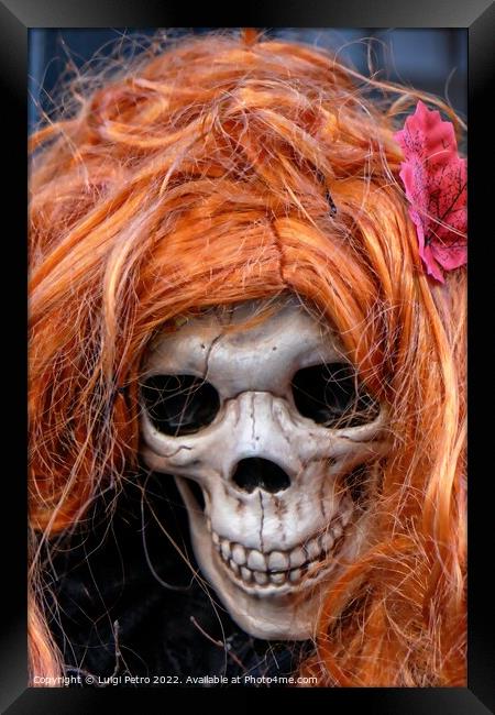 Skull wearing an orange wig. Framed Print by Luigi Petro