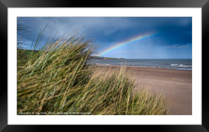 A rainbow over Luananbay beach Framed Mounted Print by Joe Dailly