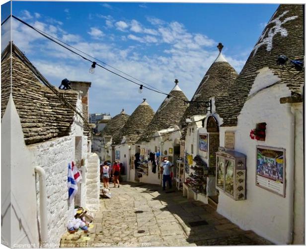 Shopping in Alberobello Canvas Print by Sheila Ramsey